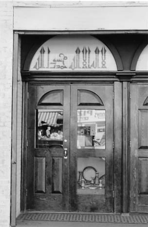 The Turkish community's Al-Fatih Mosque: former movie theater ticket booth converted to a religious bookstore.