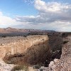 A photo of the land art, Double Negative, which features a deep trench in the earth.