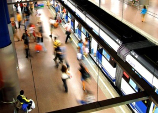 Passengers boarding a subway in Madrid.