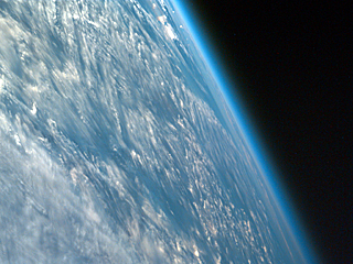  Oblique shot of the Earth from space featuring its curvature and atmosphere.