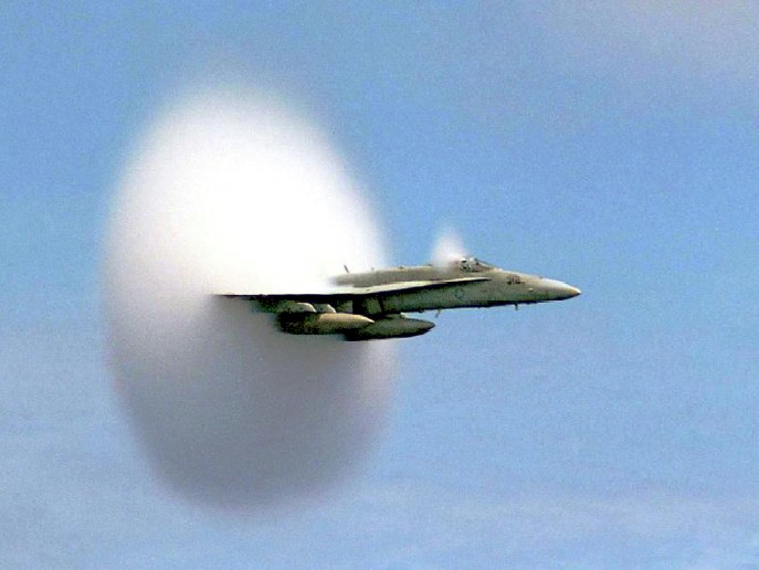 F16 fighter jet in cloud formation.