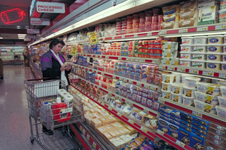 A photograph of a woman shopping in a Giant Supermarket.