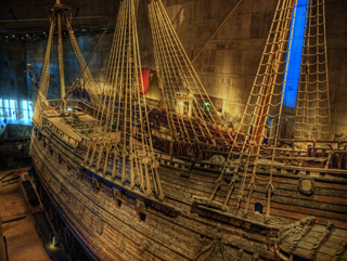 Photo of starboard side of the Swedish warship Vasa with carved statue detail.