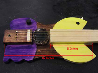 Electric guitar shaped like pac-man.