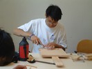 Student working on their guitar.